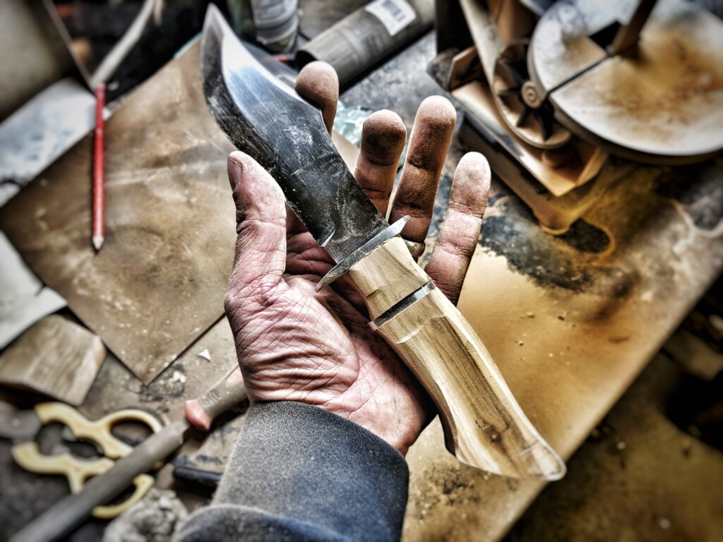 Hidden tang knife in the making with raw unfinished handle